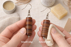 Two pairs of leather earrings held in hands – comparison of smooth and natural disc edges