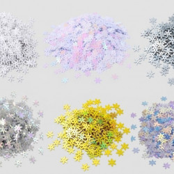 Six piles of 8mm snowflake sequins in silver, laser silver, white, white AB, white pearl and yellow AB arranged on light grey background